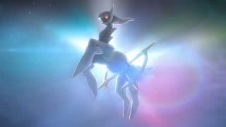 The God Pokémon Arceus in front of a rainbow background, its front legs reared.